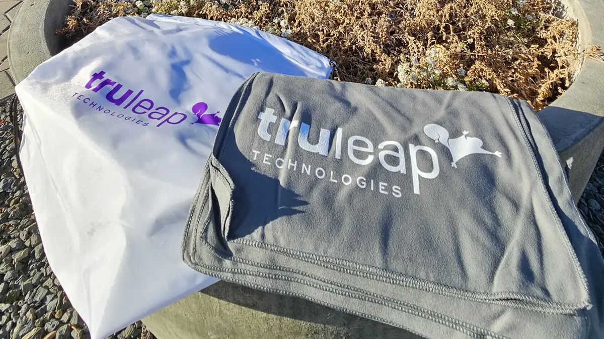 Branded drawstring bag and cooling towel runner event swag for TruLeap Technology